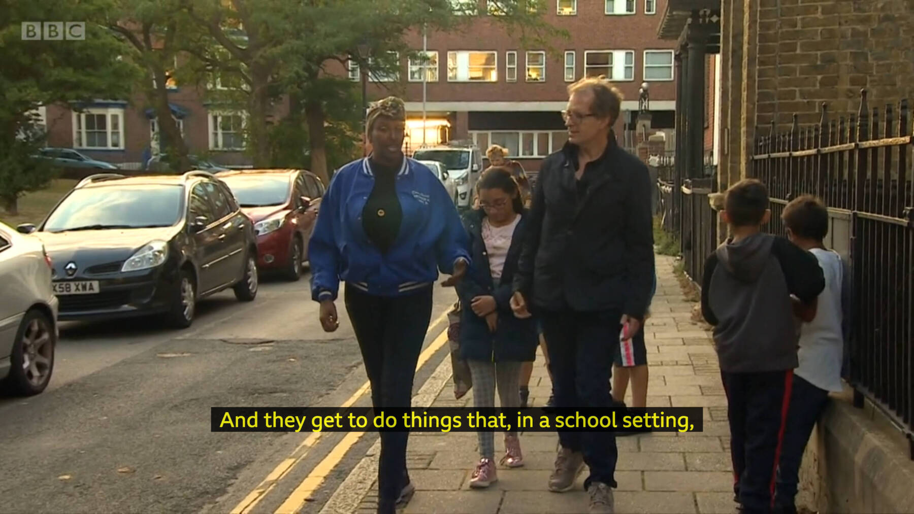 The BBC’s David Sillito walking down the street in Margate with the kids of Open School East’s Despacito Art School